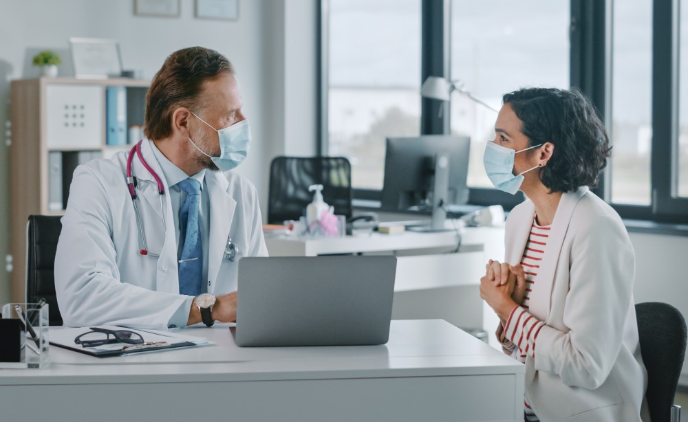 Patient and doctor looking happy